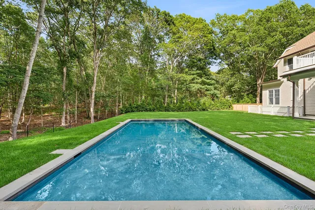 a view of a backyard with a small pool