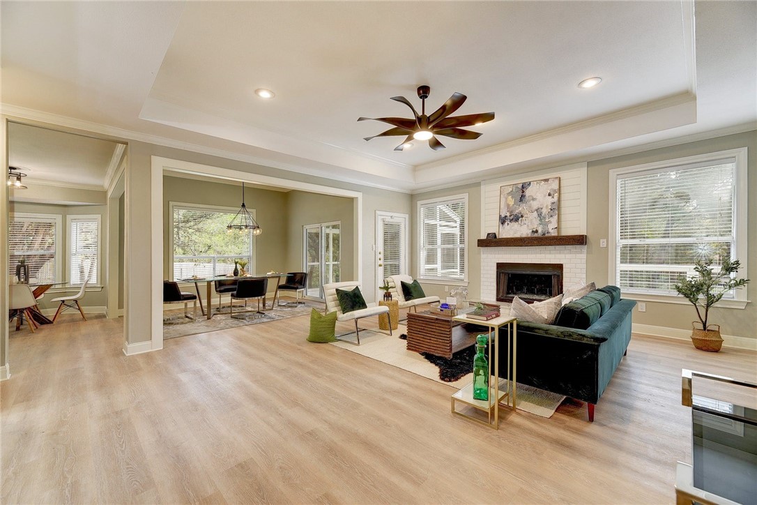 a living room with furniture and a fireplace