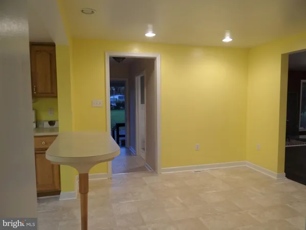 a room with table and chairs