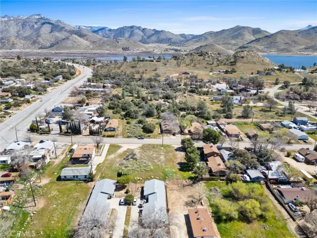 an aerial view of houses with a city