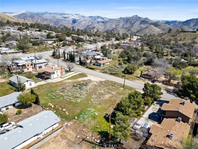 a view of a city with mountains in the background