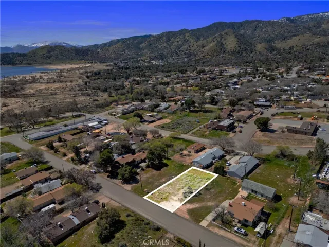 an aerial view of residential building with green space