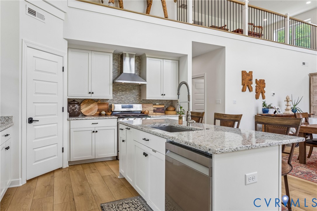 2016 Forge Road Toano, VA 23168 - Photo 55 of 99 Modern kitchen featuring white cabinetry, a large