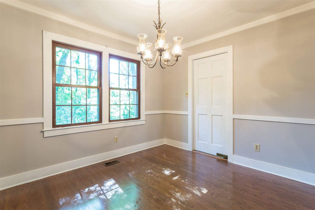 8816 Woodstone Drive Raleigh, NC 27615 - Photo 7 of 30 Formal Dining Room offers hardwood flooring, wide molding accent and chair rail. Dining Room