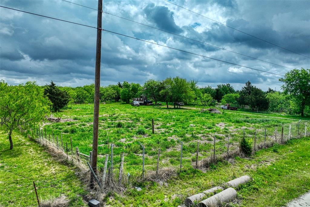 206 185th Rice, TX 75155 - Photo 5 of 23 a view of a garden with a building in the background