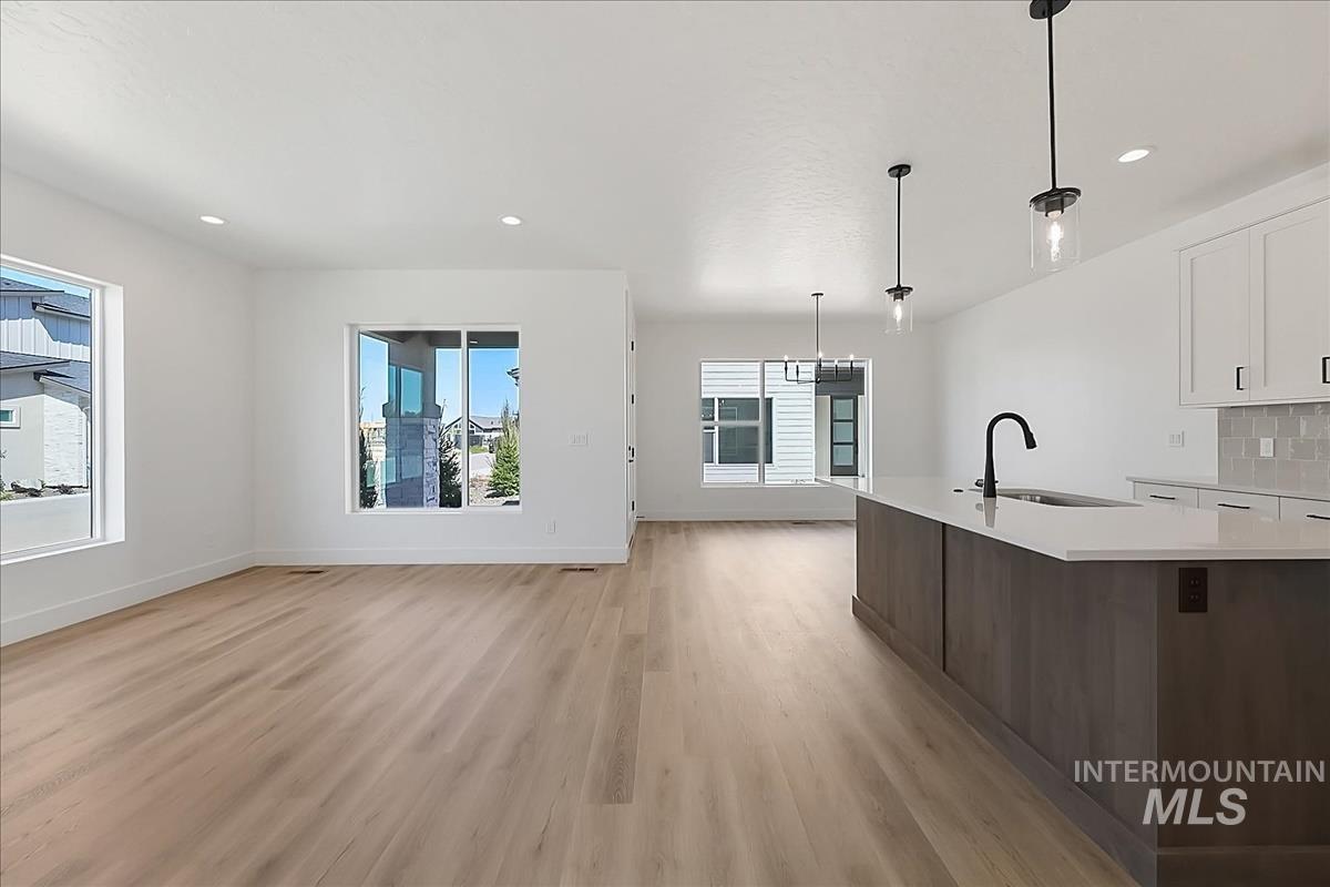 776 South Calhoun Lane Star, ID 83669 - Photo 19 of 49 Open-concept living space with light wood-finish flooring