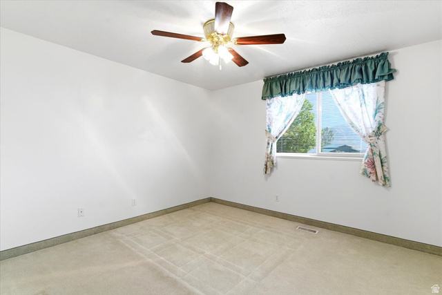 72 Canal Bank Road Garland, UT 84312 - Photo 19 of 40 Carpeted room featuring a ceiling fan with light fixture, a window with blinds, and white walls