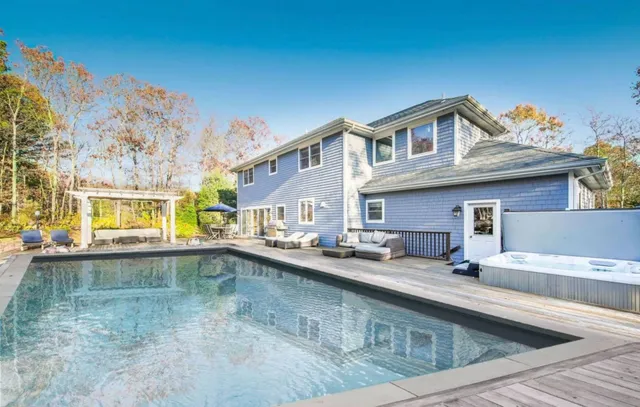 a view of a kitchen with a sink and cabinets