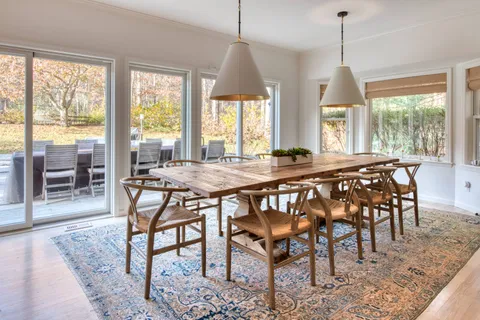 a dining room with furniture window wooden floor