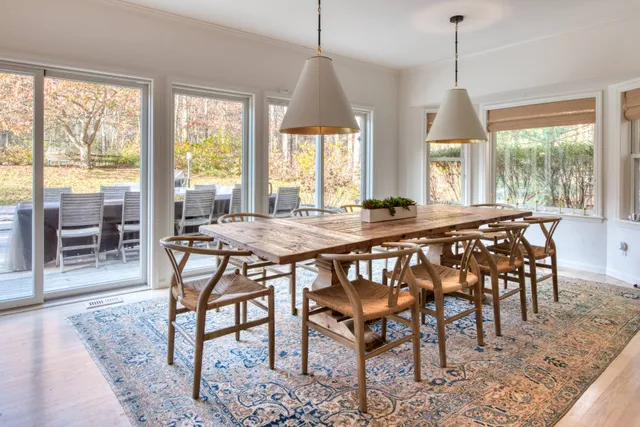 a dining room with furniture window wooden floor