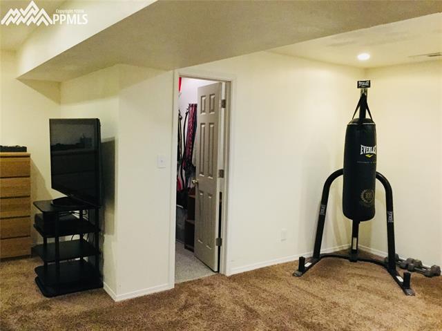 2095 Legacy Ridge View, Unit 112 Colorado Springs, CO 80910 - Photo 22 of 28 Extra space in this bonus area. Great for a sitting area or work out.