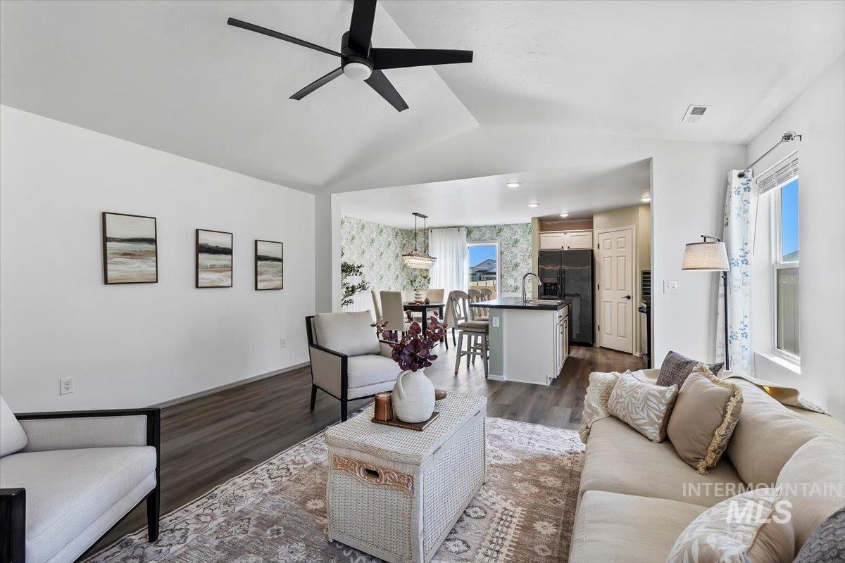 12781 Ashfield Street Caldwell, ID 83607 - Photo 6 of 30 Living room with ceiling fan and dark wood-type flooring