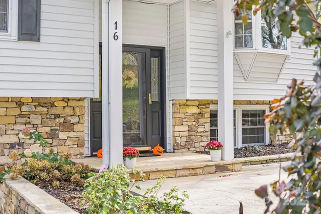 a front view of a house with a outdoor space