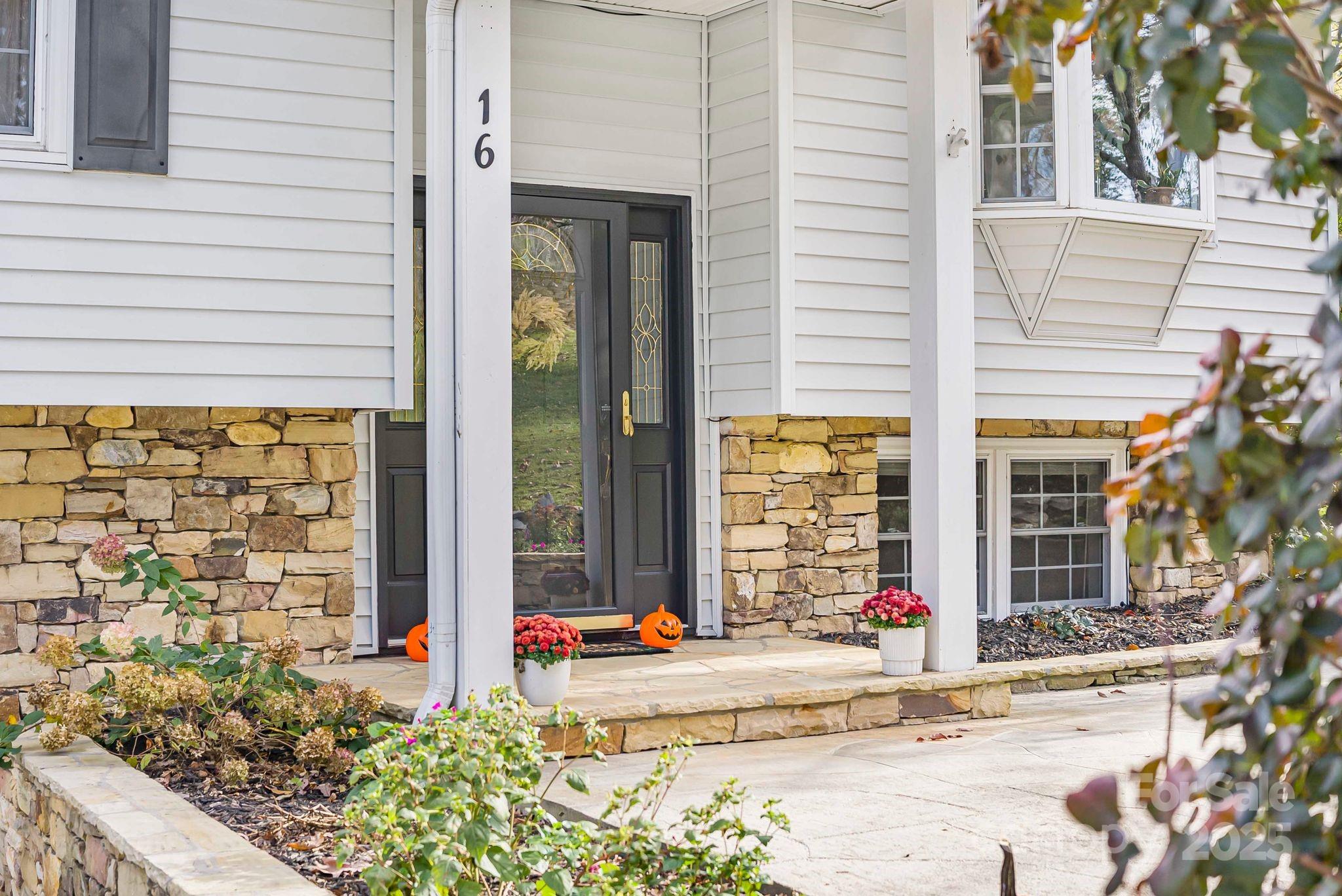 a front view of a house with a outdoor space