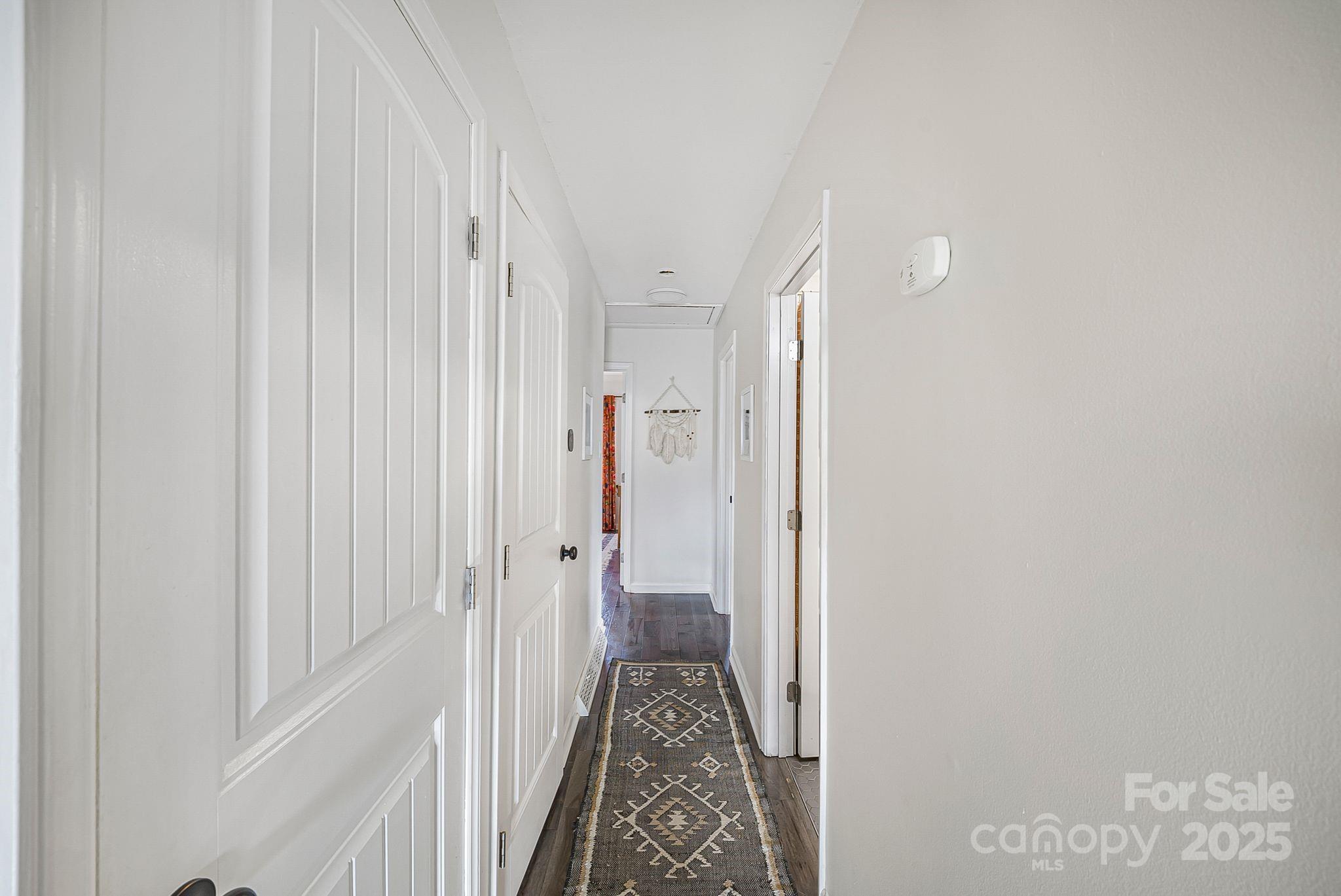 16 Woodfield Road Arden, NC 28704 - Photo 14 of 41 a view of a hallway with white walls