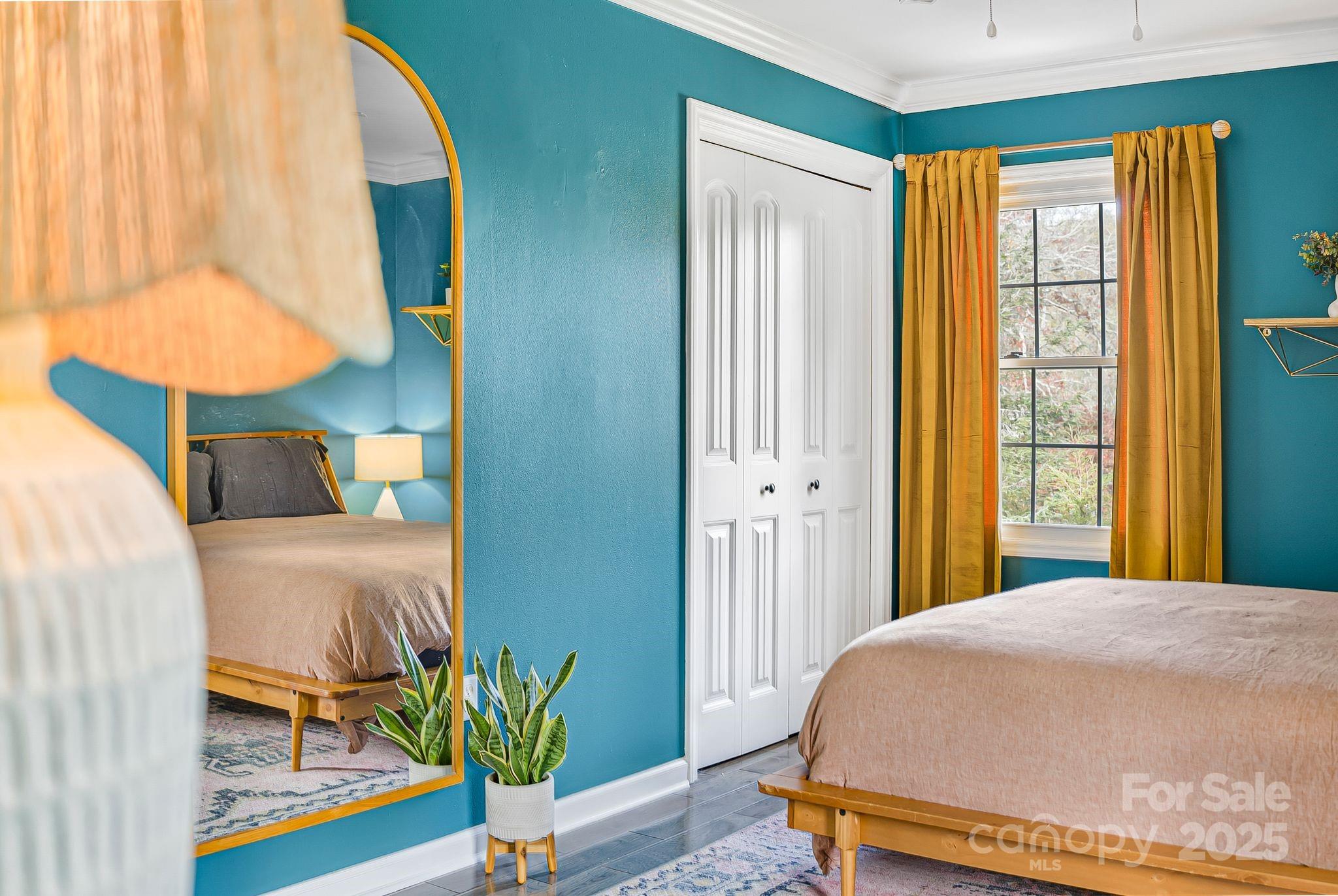 16 Woodfield Road Arden, NC 28704 - Photo 17 of 41 a bedroom with a bed and a painting on the wall