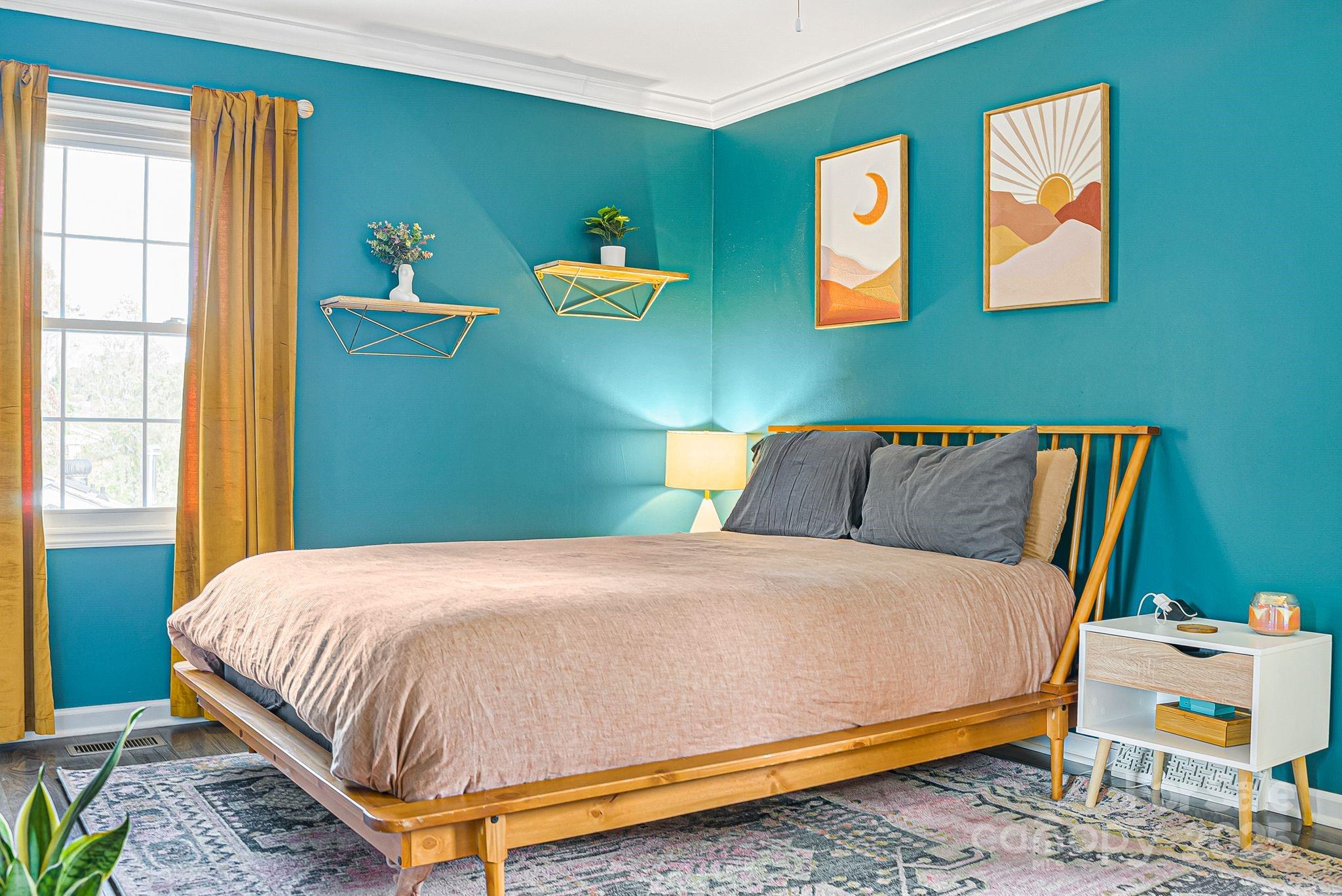 16 Woodfield Road Arden, NC 28704 - Photo 18 of 41 a bed sitting in a bedroom next to a window