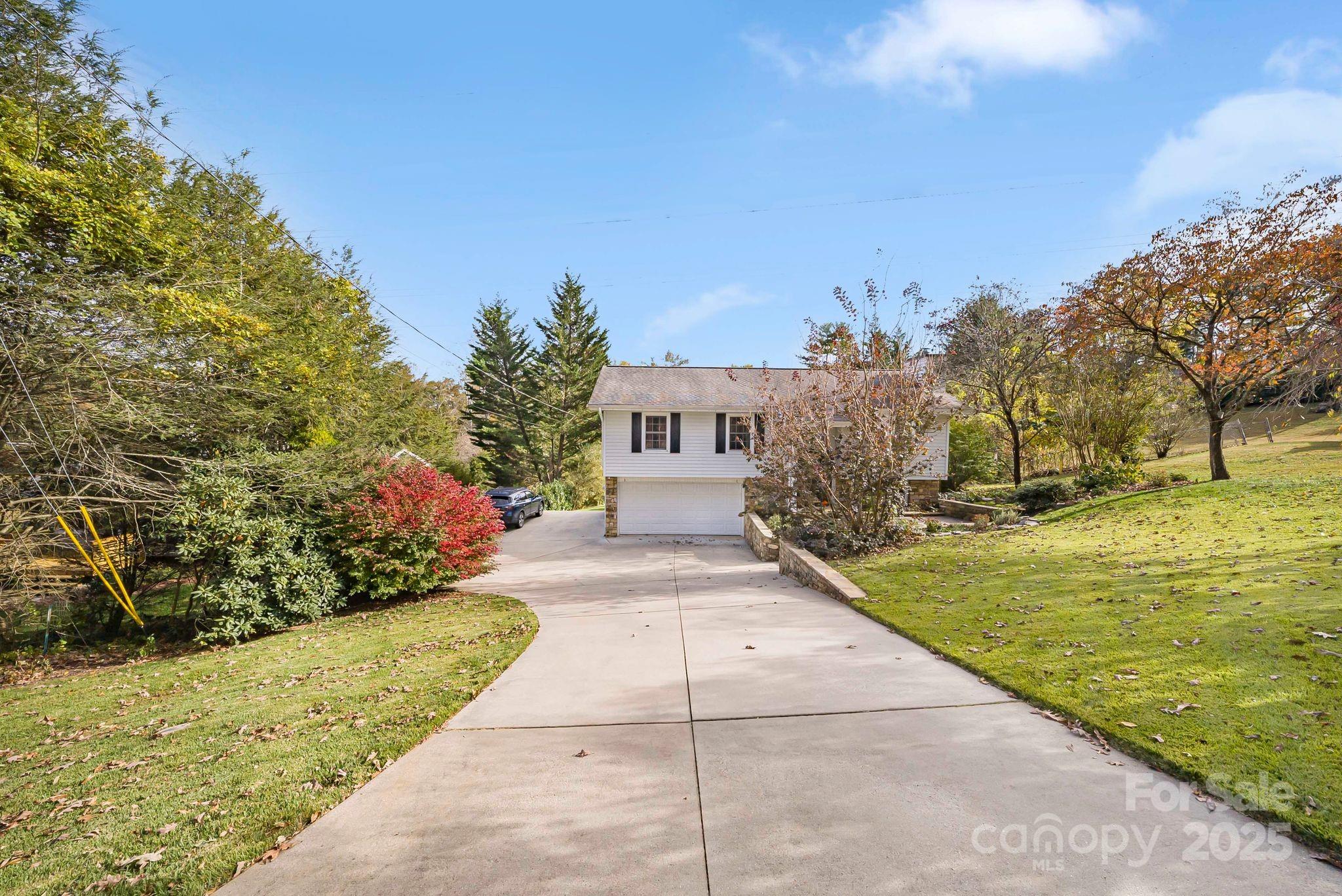 16 Woodfield Road Arden, NC 28704 - Photo 40 of 41 a front view of a house with a yard