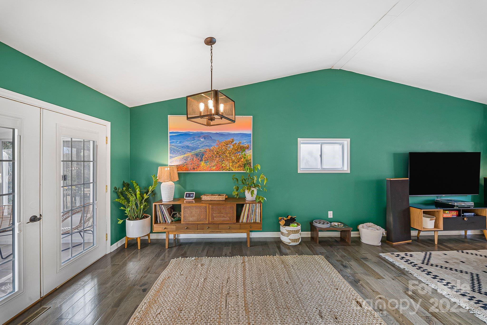 16 Woodfield Road Arden, NC 28704 - Photo 9 of 41 a living room with furniture and a flat screen tv