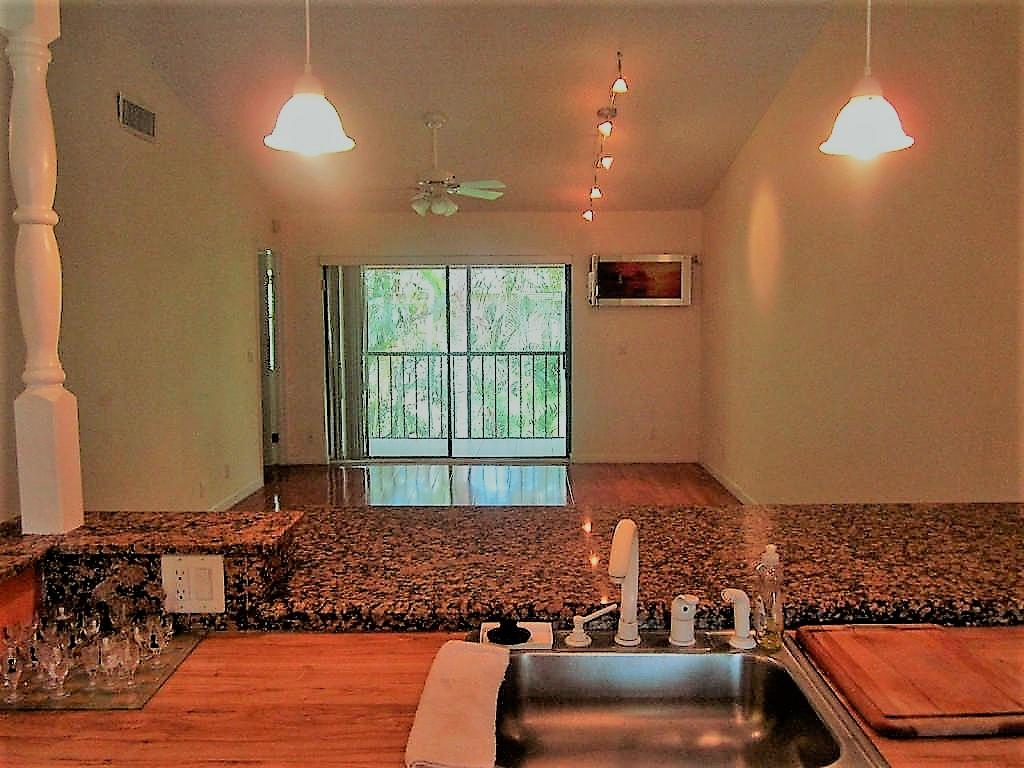 22052 Palms Way, Unit 203 Boca Raton, FL 33433 - Photo 9 of 24 VIEW FROM KITCHEN INTO LIVING ROOM