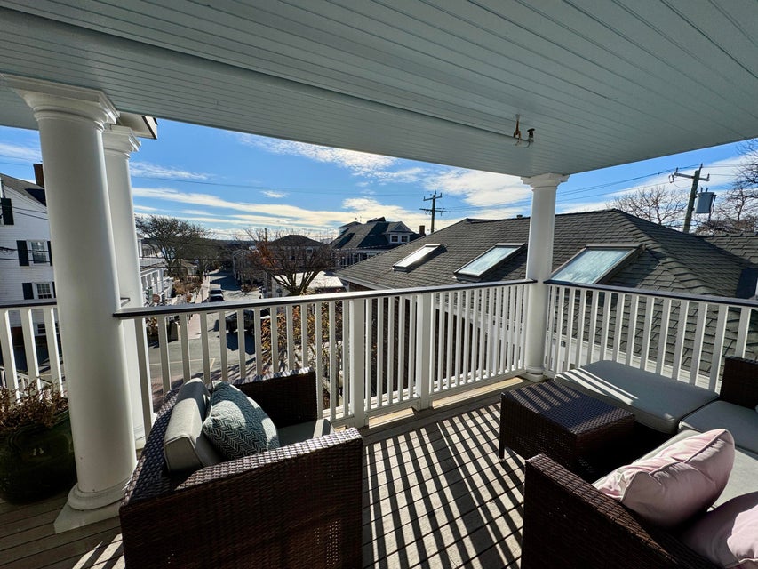 38 North Water Street, Unit R2 Edgartown, MA 02539 - Photo 14 of 38 Living room with propane fireplace and sliders leading to the private deck facing Edgartown Harbor.