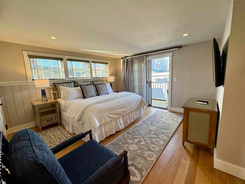 38 North Water Street, Unit R2 Edgartown, MA 02539 - Photo 29 of 38 King bedroom suite with private balcony overlooking the brick courtyard with al-fresco dininng, lounge area and grills for residence club owners.