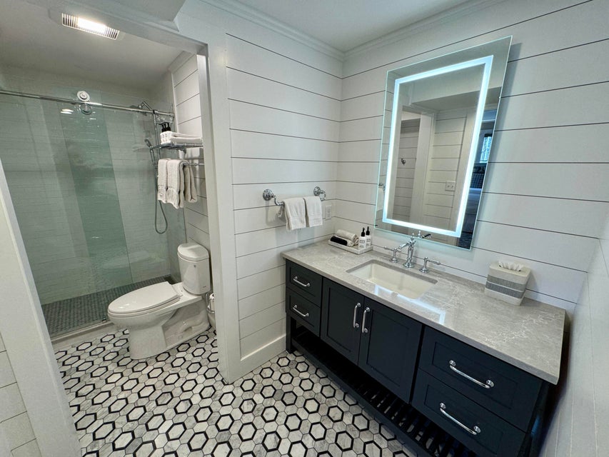 38 North Water Street, Unit R2 Edgartown, MA 02539 - Photo 31 of 38 Luxury bath with marble tile, stone countertops and gall shower enclosure.