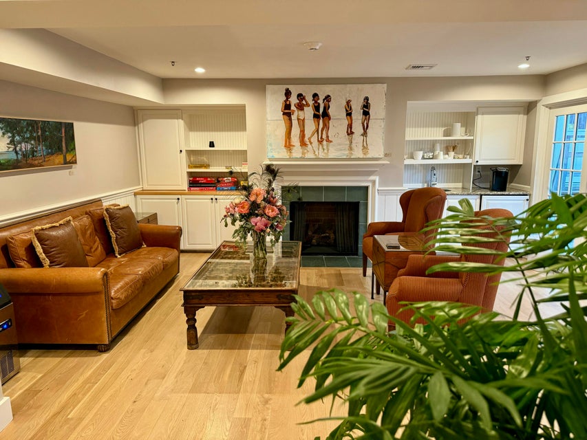 38 North Water Street, Unit R2 Edgartown, MA 02539 - Photo 9 of 38 Owners lounge with fireplace, coffee bar and french doors to the outdoor courtyard and grills