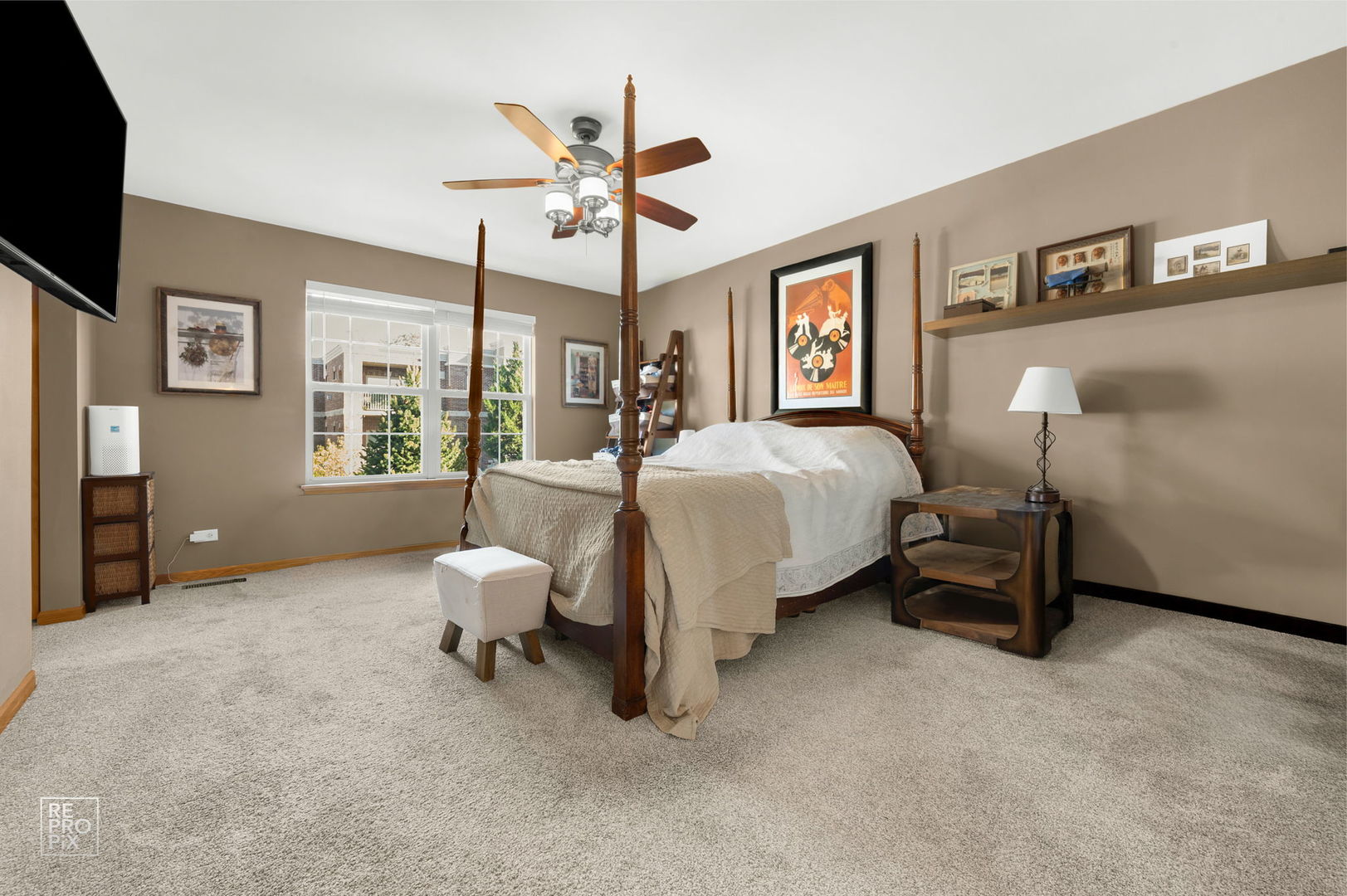 29 Bay Drive Itasca, IL 60143 - Photo 17 of 28 a bedroom with a bed and a chandelier