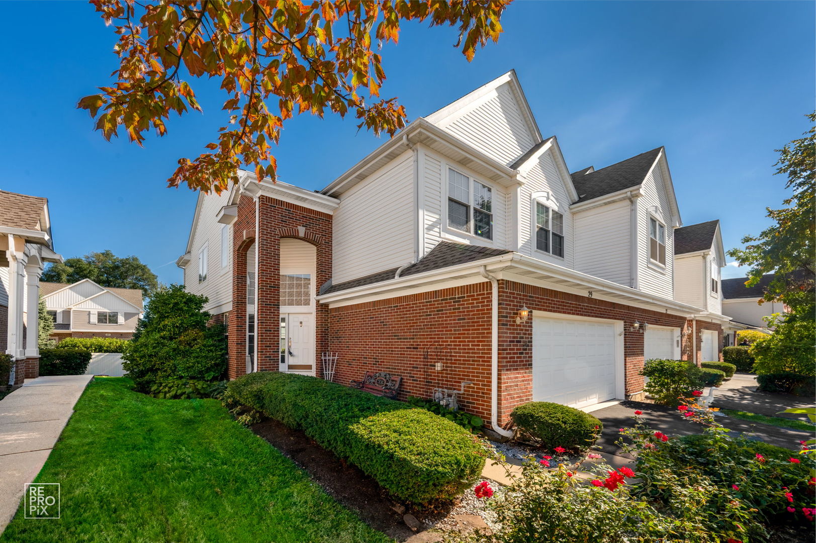 29 Bay Drive Itasca, IL 60143 - Photo 2 of 28 a view of a house with a small yard plants and a large tree