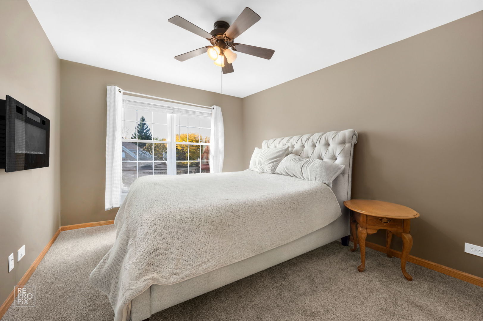 29 Bay Drive Itasca, IL 60143 - Photo 22 of 28 a bedroom with a bed a window and a flat screen tv