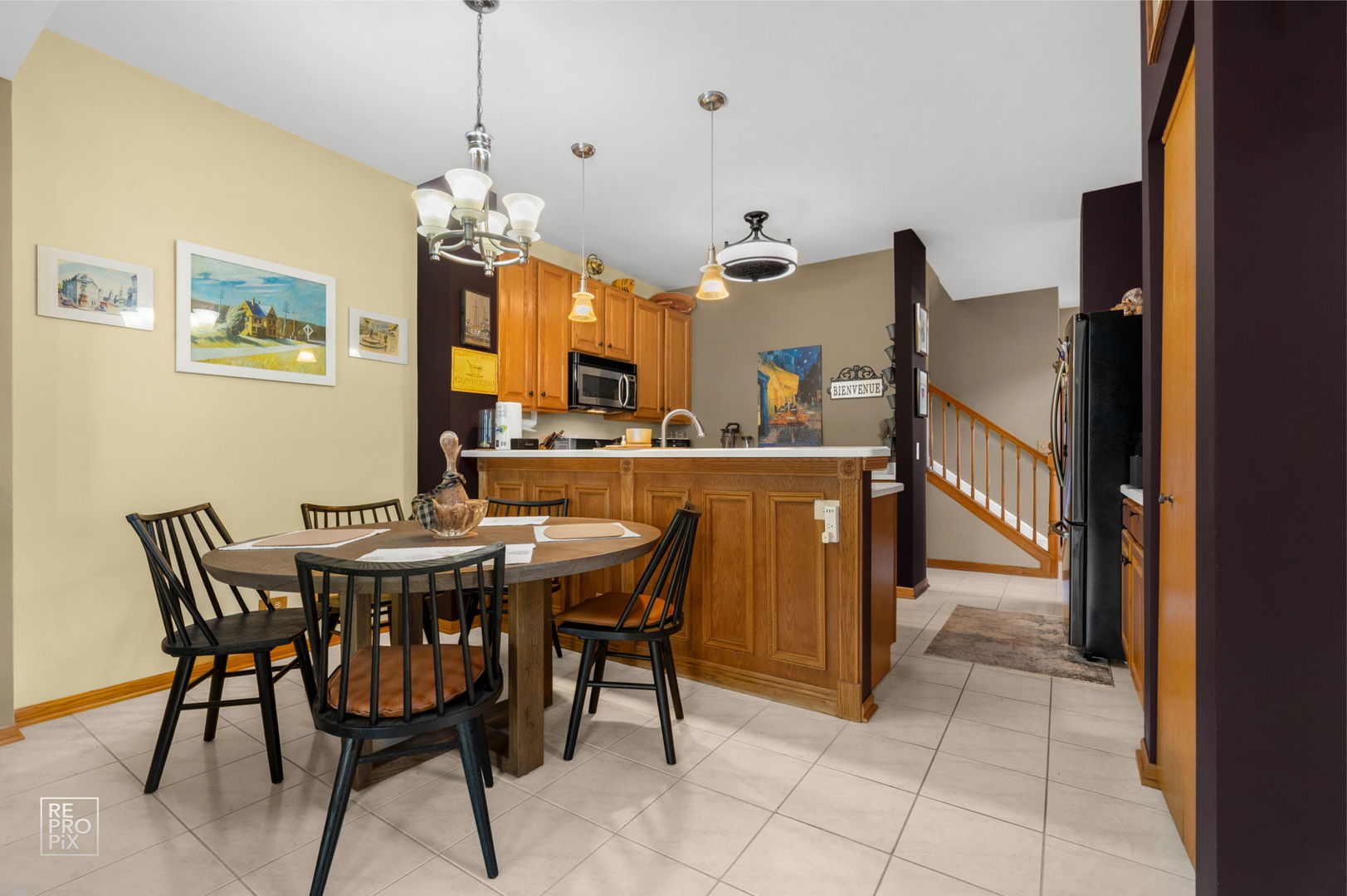 29 Bay Drive Itasca, IL 60143 - Photo 9 of 28 a view of a dining room with furniture and a chandelier