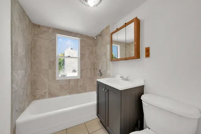 a garden with trees in front of it