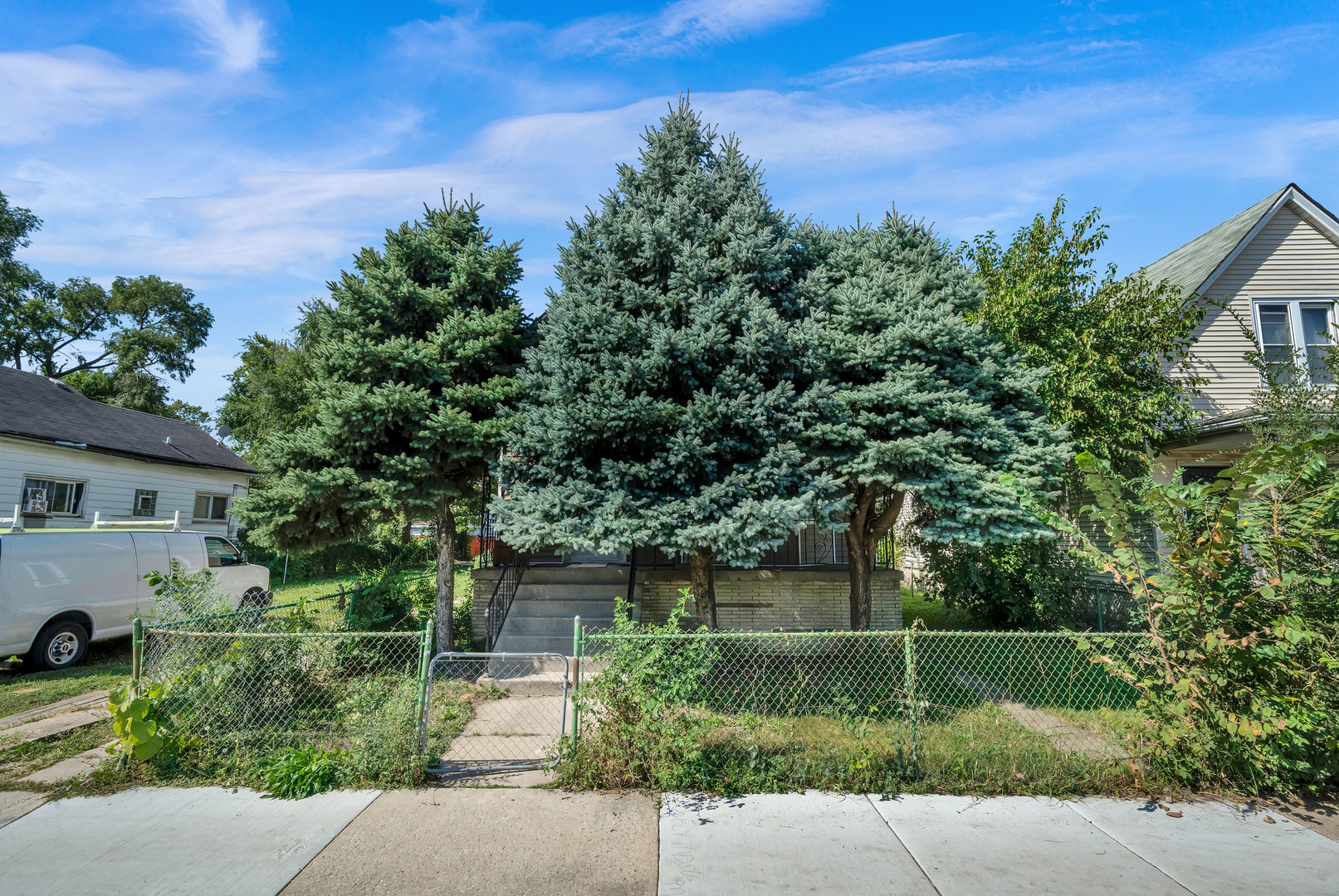 11548 South State Street Chicago, IL 60628 - Photo 20 of 22 front view of a house with a yard