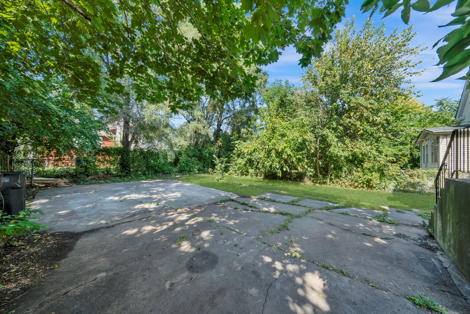 11548 South State Street Chicago, IL 60628 - Photo 21 of 22 a view of a yard with a tree