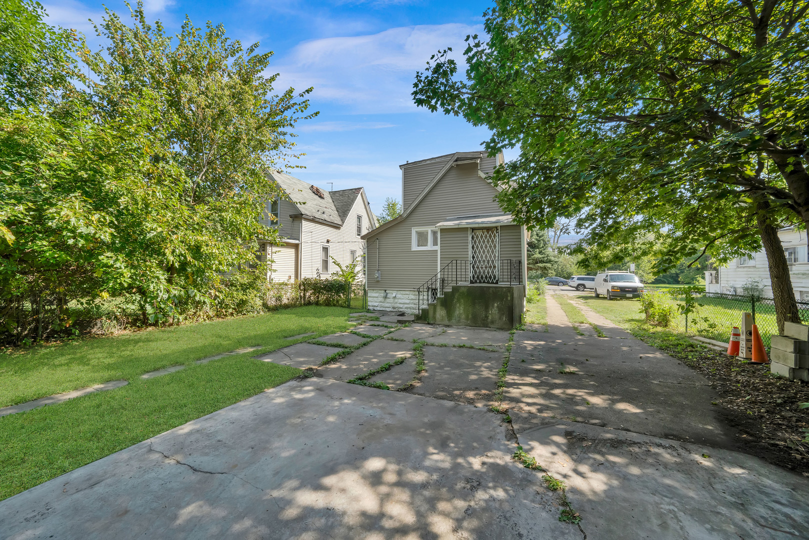 11548 South State Street Chicago, IL 60628 - Photo 22 of 22 a view of a house with a yard