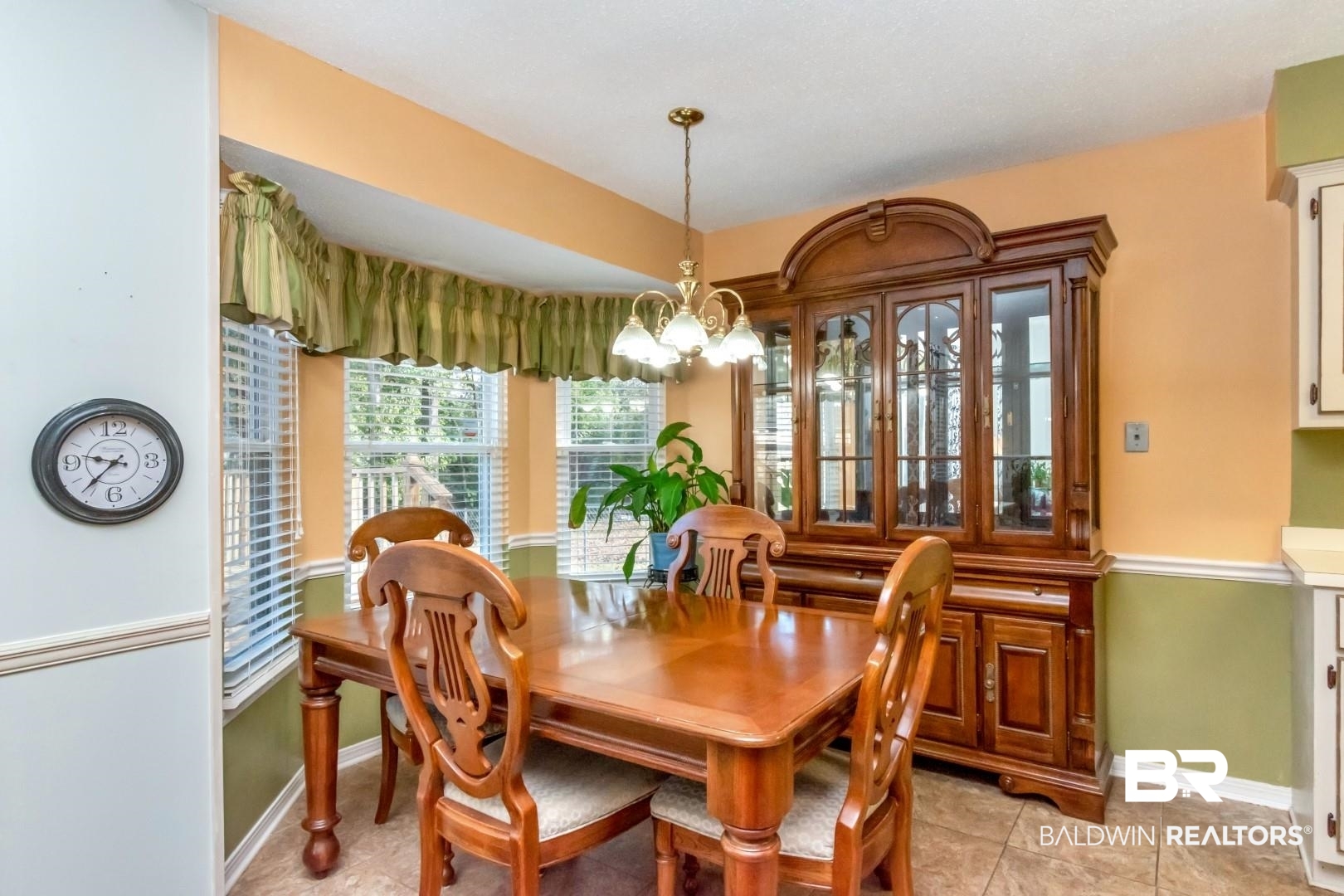 9360 Burnt Tree Drive Mobile, AL 36695 - Photo 3 of 28 Dining space featuring light tile patterned floors and a chandelier