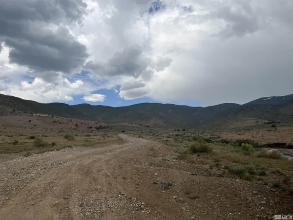 a view of mountain with sky