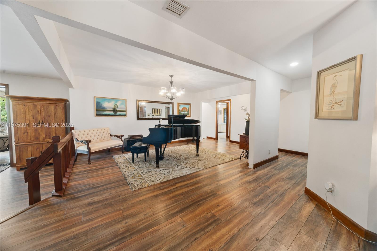 1872 Southeast Colony Way Jupiter, FL 33478 - Photo 16 of 26 a view of a dining room with furniture and wooden floor