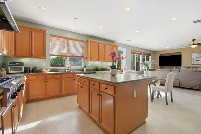 a bathroom with a sink a mirror and a window