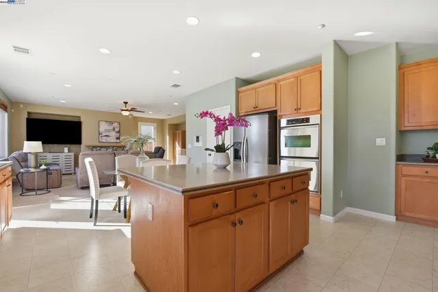 a kitchen with stainless steel appliances granite countertop a stove and a microwave