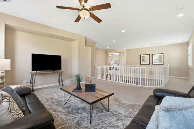 a bedroom with a bed and a sink