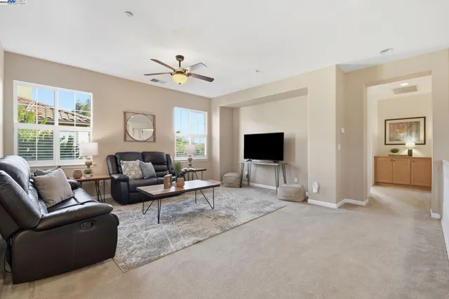 a bedroom with a bed and a mirror