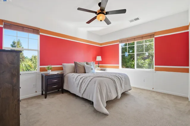 a kitchen with cabinets and window