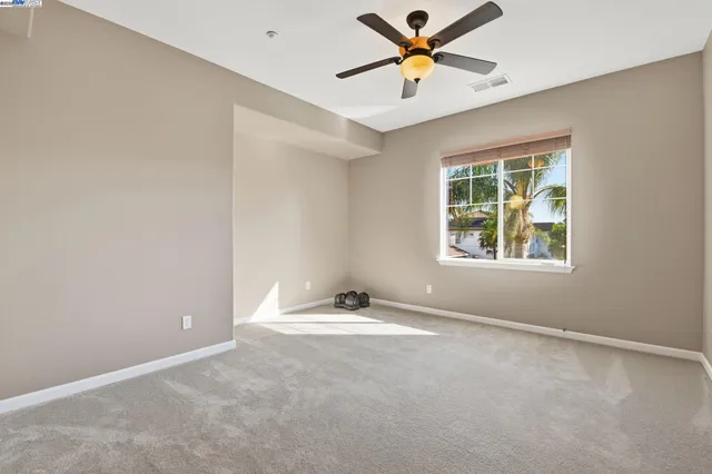 a white bath tub sitting next to a toilet