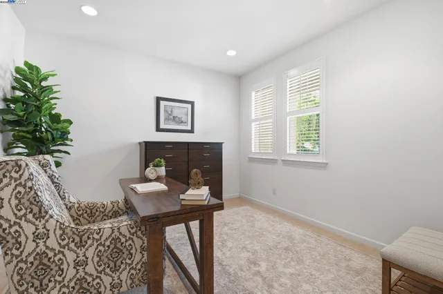 a dining room with furniture and chandelier