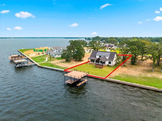 an ocean with a table and chairs