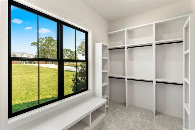a view of walk in closet with window