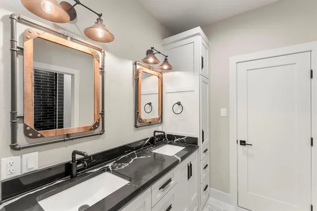 a bathroom with a sink and a mirror