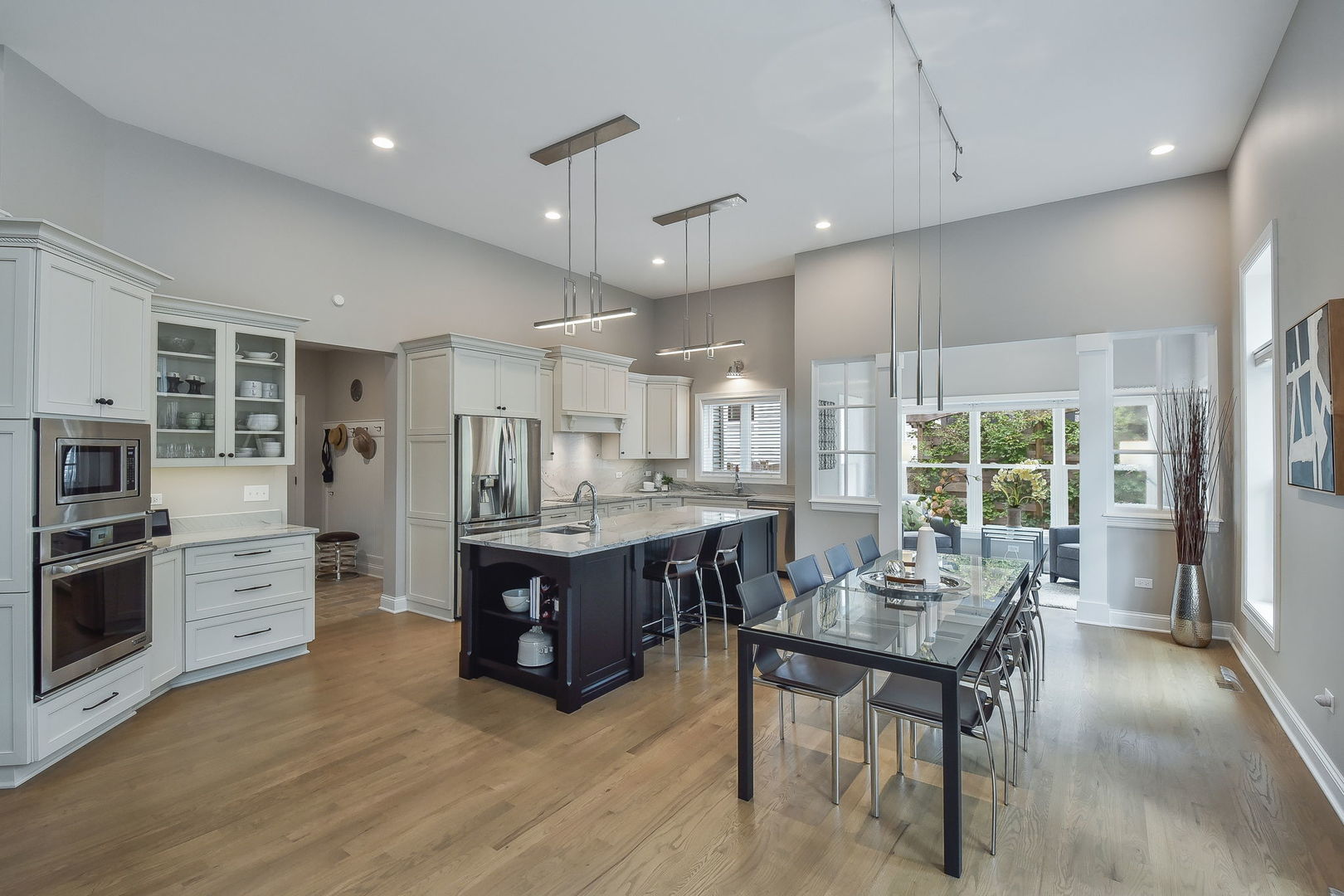 436 East Hillside Road Naperville, IL 60540 - Photo 14 of 59 a living room with stainless steel appliances granite countertop furniture wooden floor and a view of kitchen